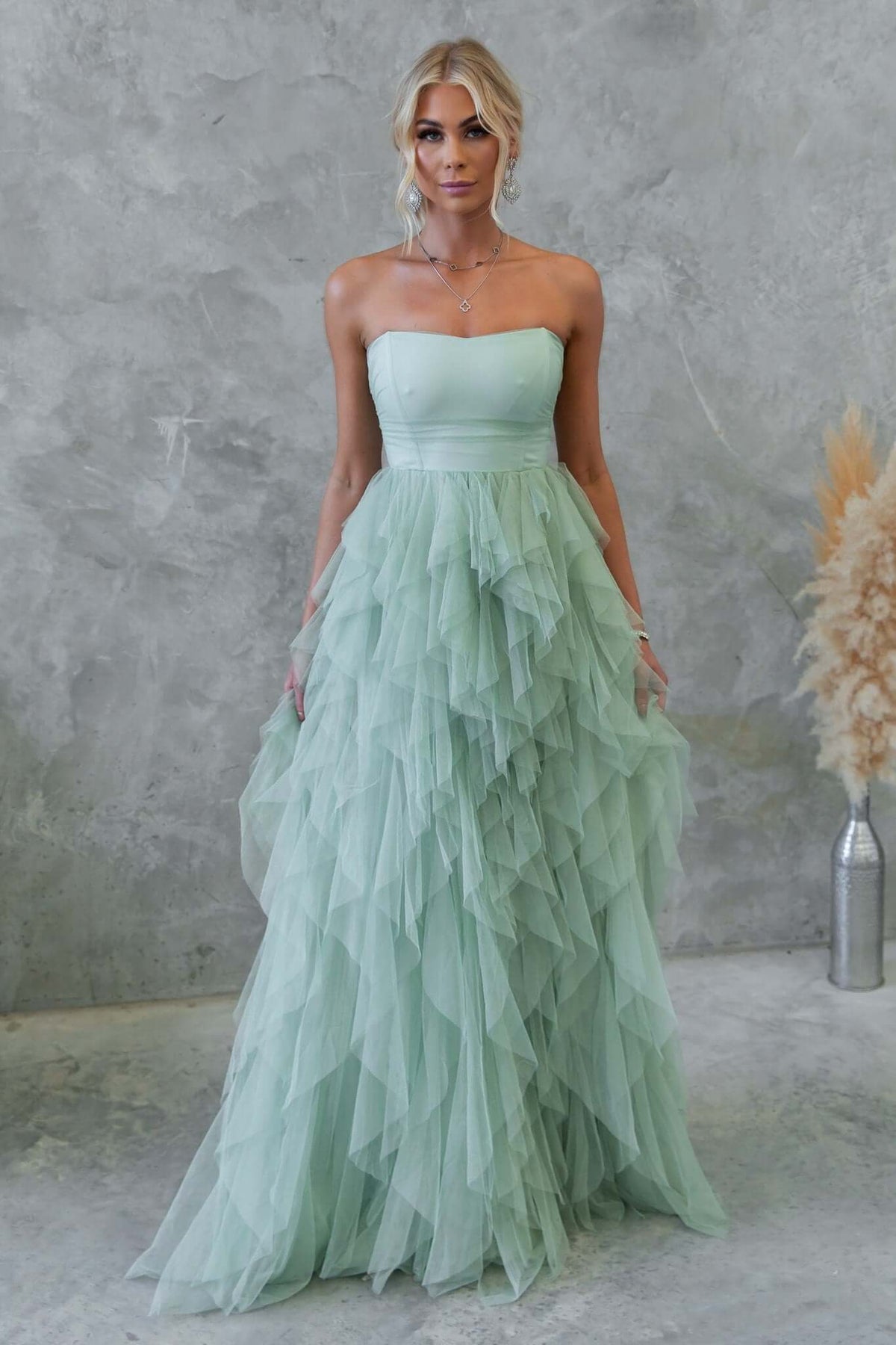 Strapless Carrie Maxi Dress in mint green with tulle overlay and ruffled design, perfect for formal occasions.
