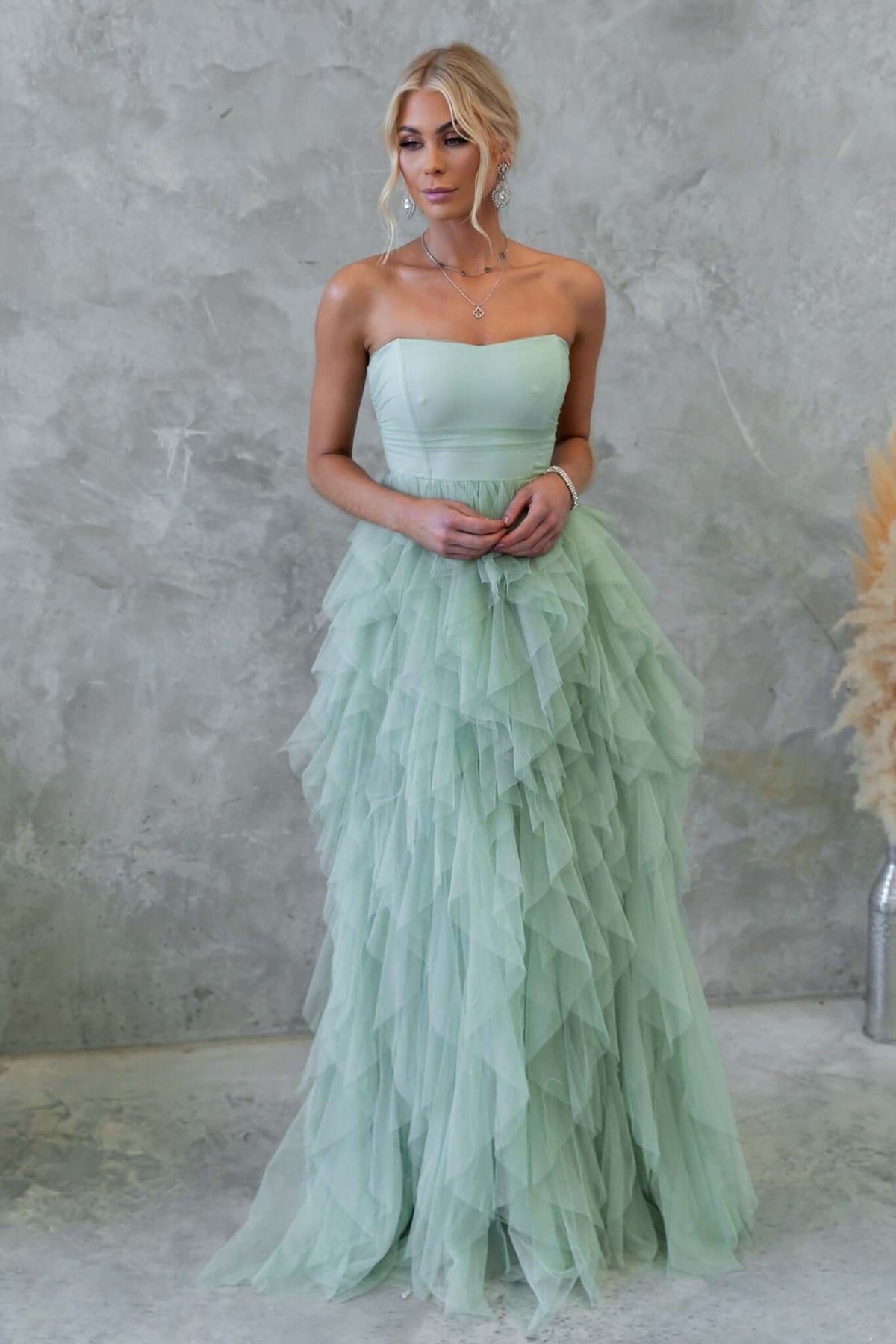 Carrie Maxi Dress in soft mint green, featuring a strapless design, tulle overlay, and layered skirt for a romantic look.