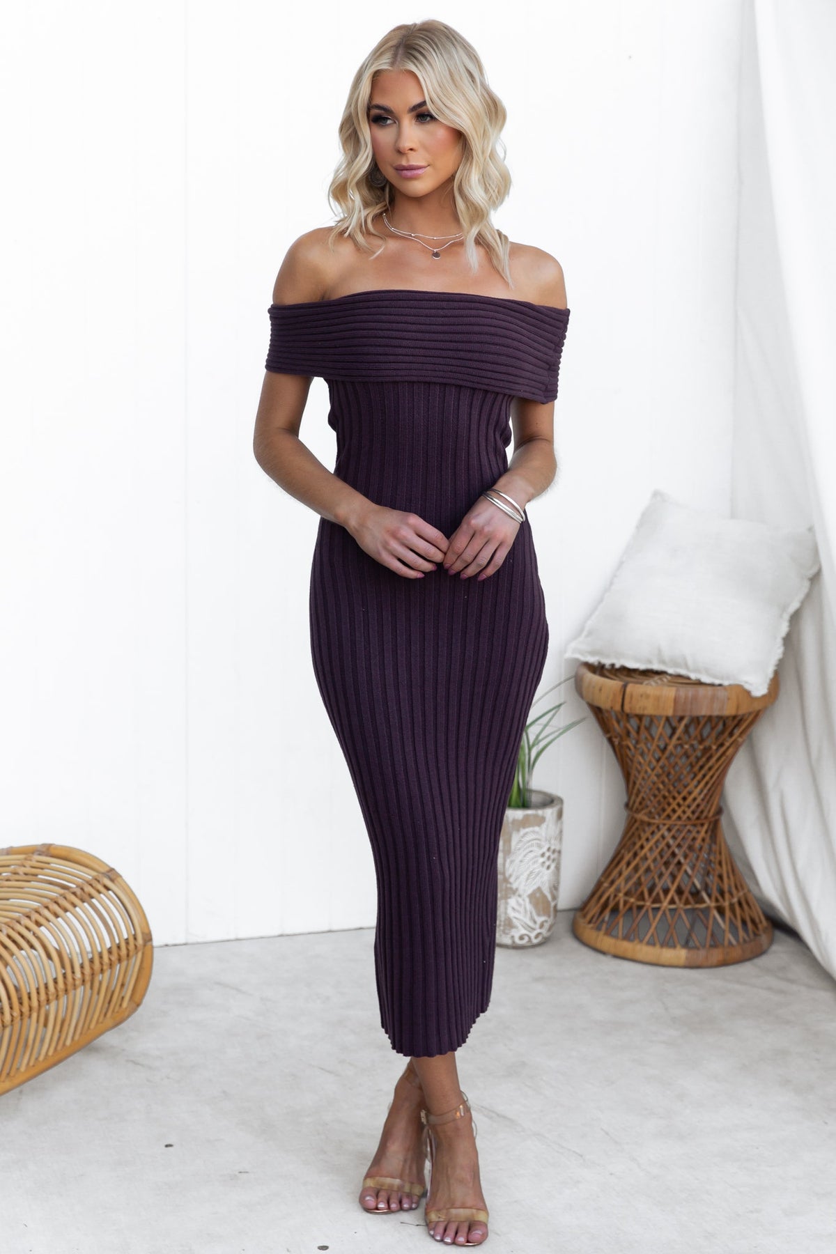 Elegant off-shoulder Soulful Midi Dress in ribbed knit, showcasing a model in a stylish indoor setting.