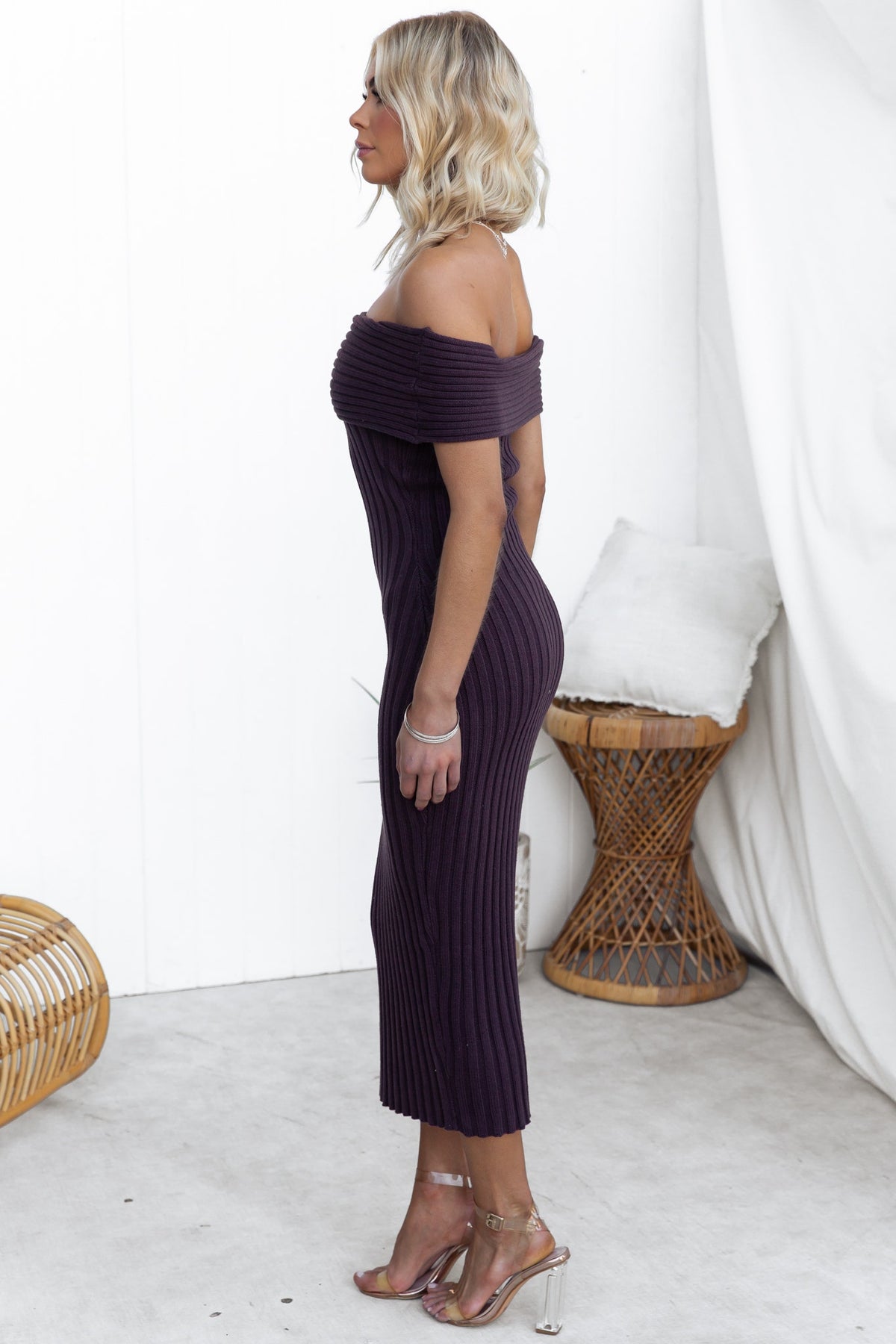 Model wearing a Soulful Midi Dress in ribbed knit material, featuring an off-shoulder neckline and a sleek fit.