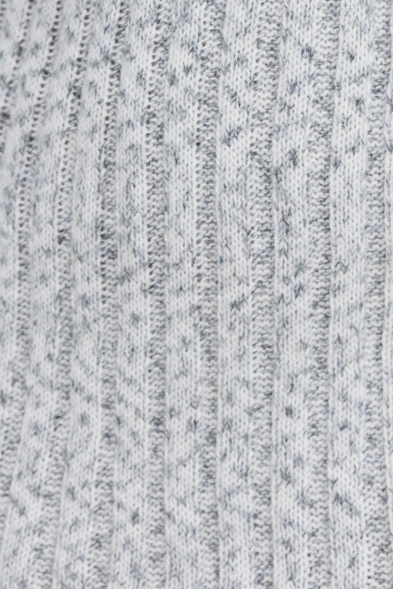 Close-up of ribbed knit fabric in light gray, showcasing the texture and design for the Rosemary Dress.