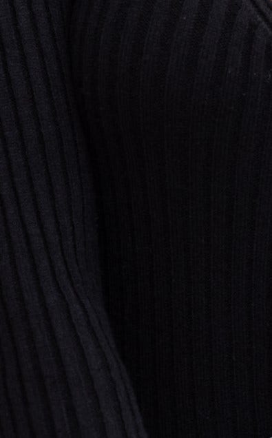 Close-up of black ribbed knit fabric showcasing texture and stretch for the Ferla Top.