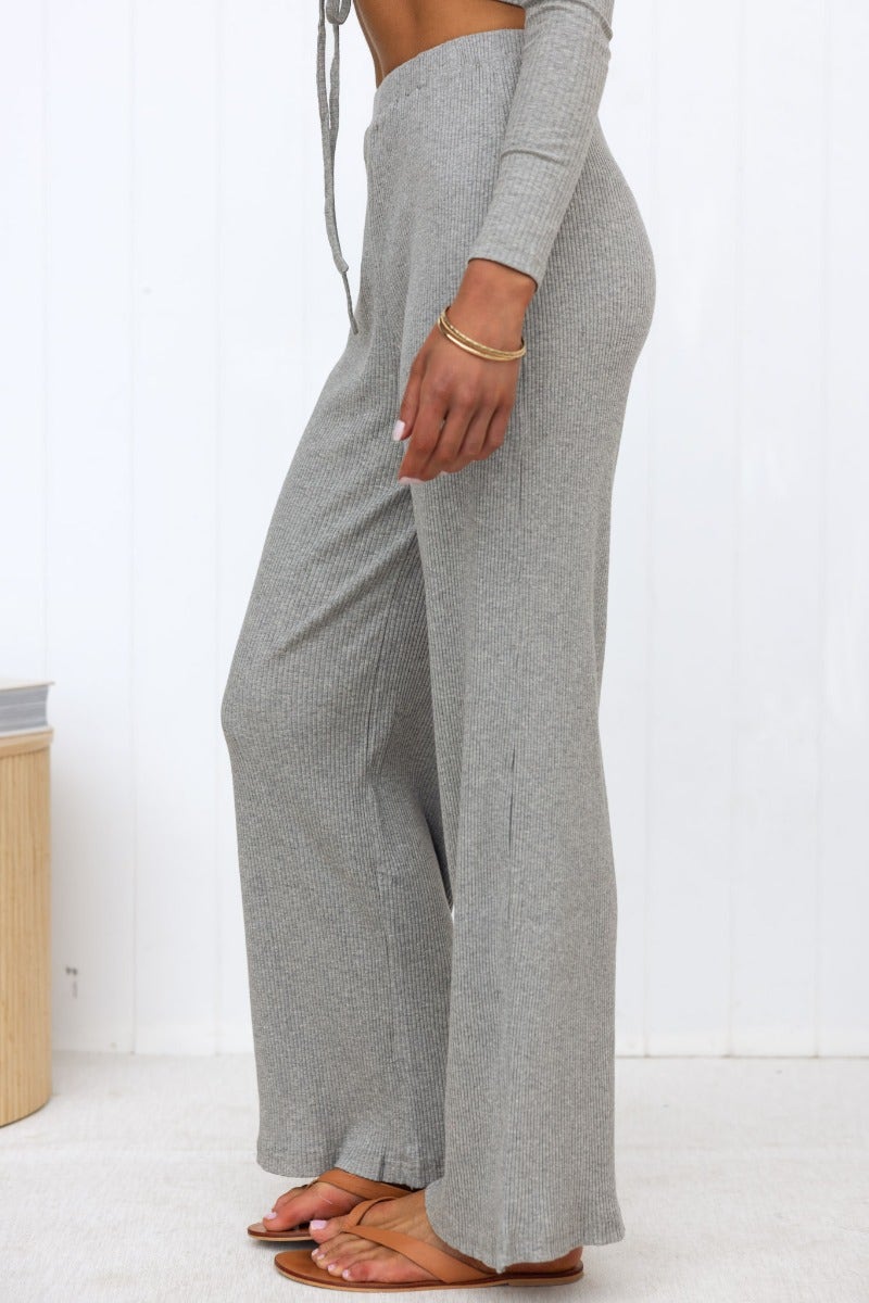 Side view of Smitten Pants, ribbed knit wide-leg pants with an elastic waistband in grey.