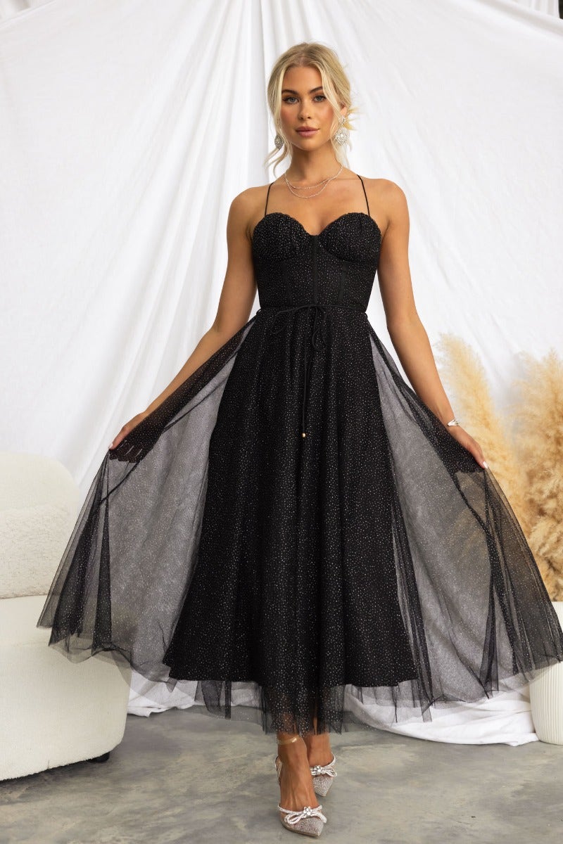 Florence Midi Dress in black tulle with adjustable straps, removable belt, and glittery material, styled by model.