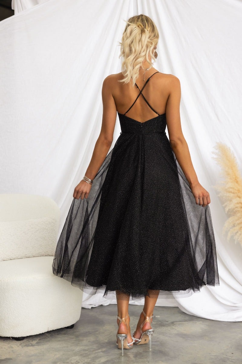 Back view of Florence Midi Dress, a black tulle dress with adjustable straps and glitter, perfect for elegant occasions.