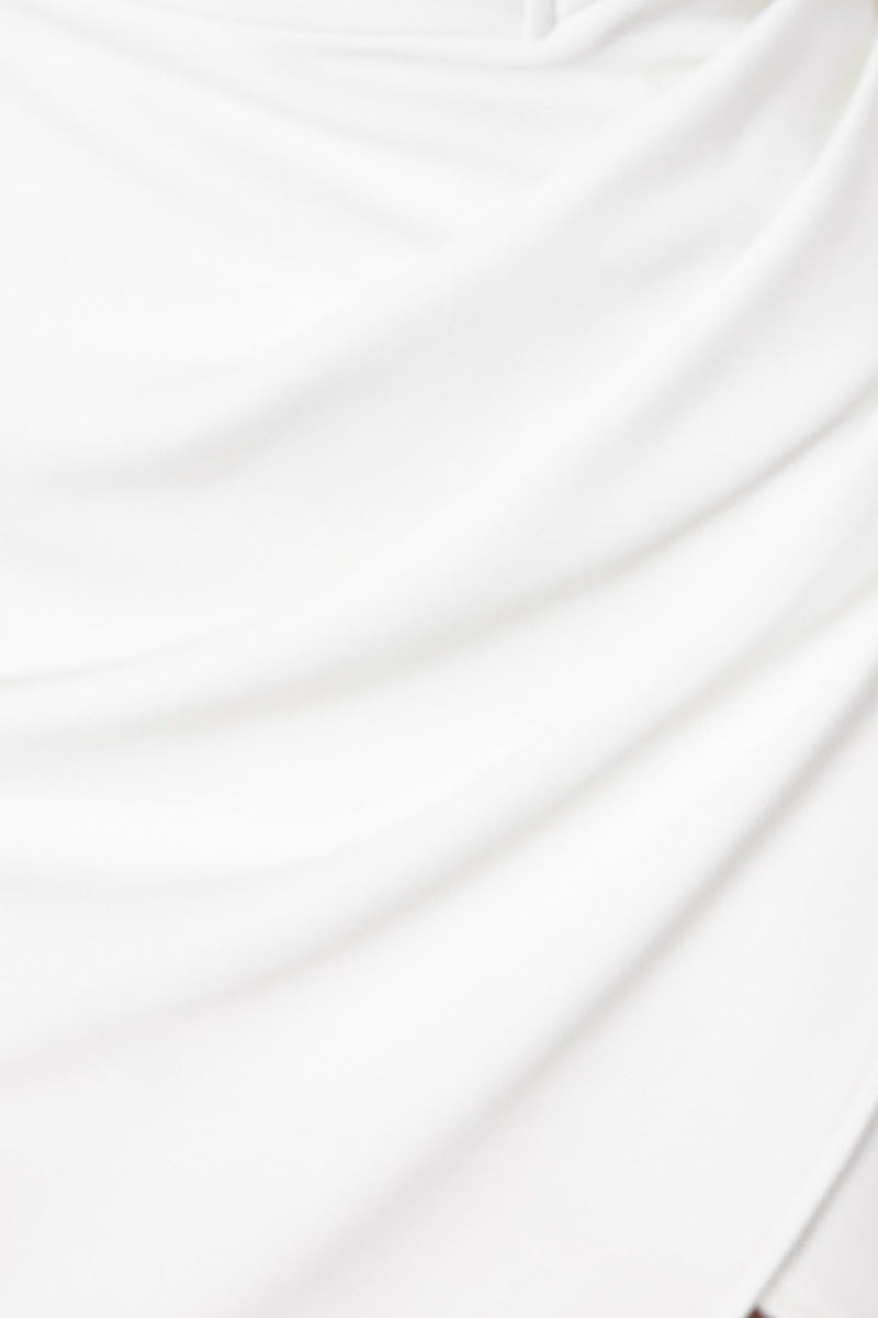 Close-up of the soft, draped fabric of the Cullen Midi Dress in white, showcasing its elegant texture.