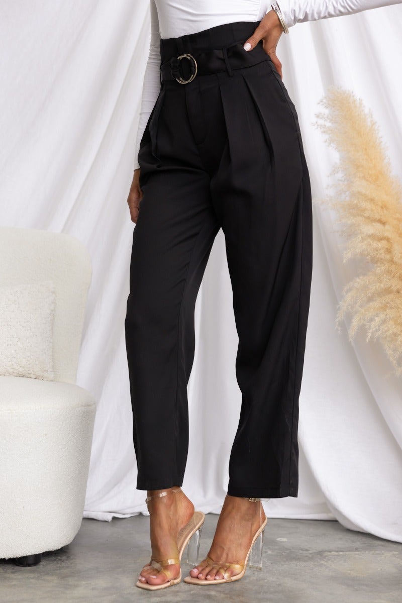 Stylish black Tahni pants with mid-high waist and removable belt, perfect for chic casual or formal looks.