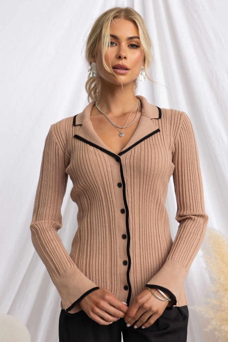 Stylish ribbed knit Shilah Top in soft beige with button-up front and sleeve splits, perfect for a trendy look.