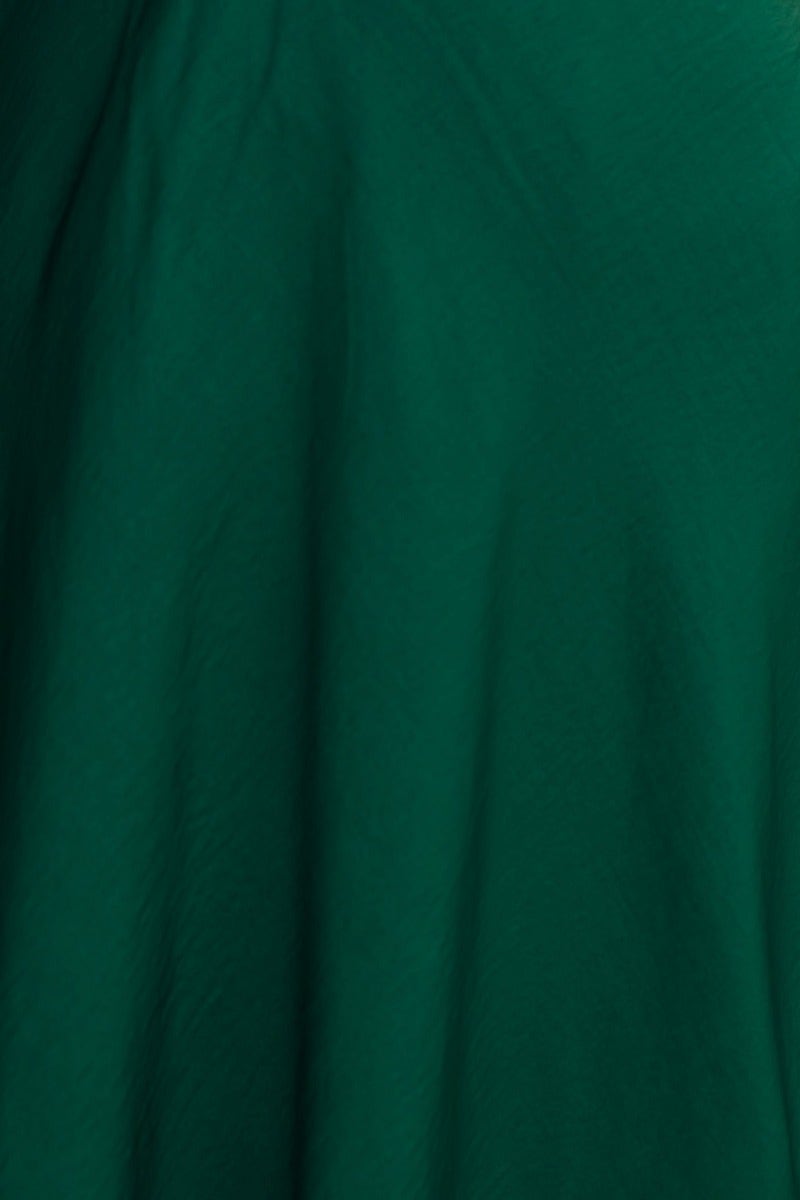 Close-up of the green Allion Midi Dress showing gathered material and soft texture.