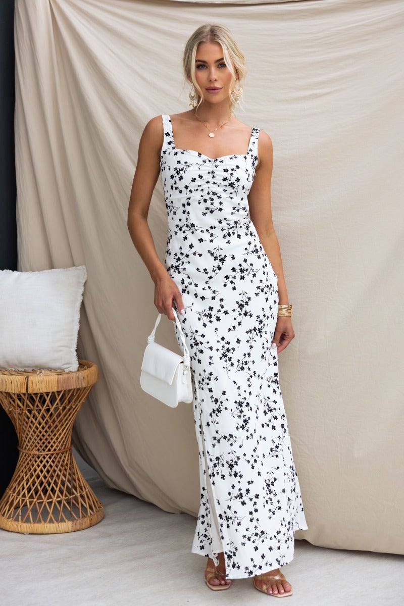 Neila Maxi Dress in floral print with adjustable straps and low-cut back, perfect for summer events.