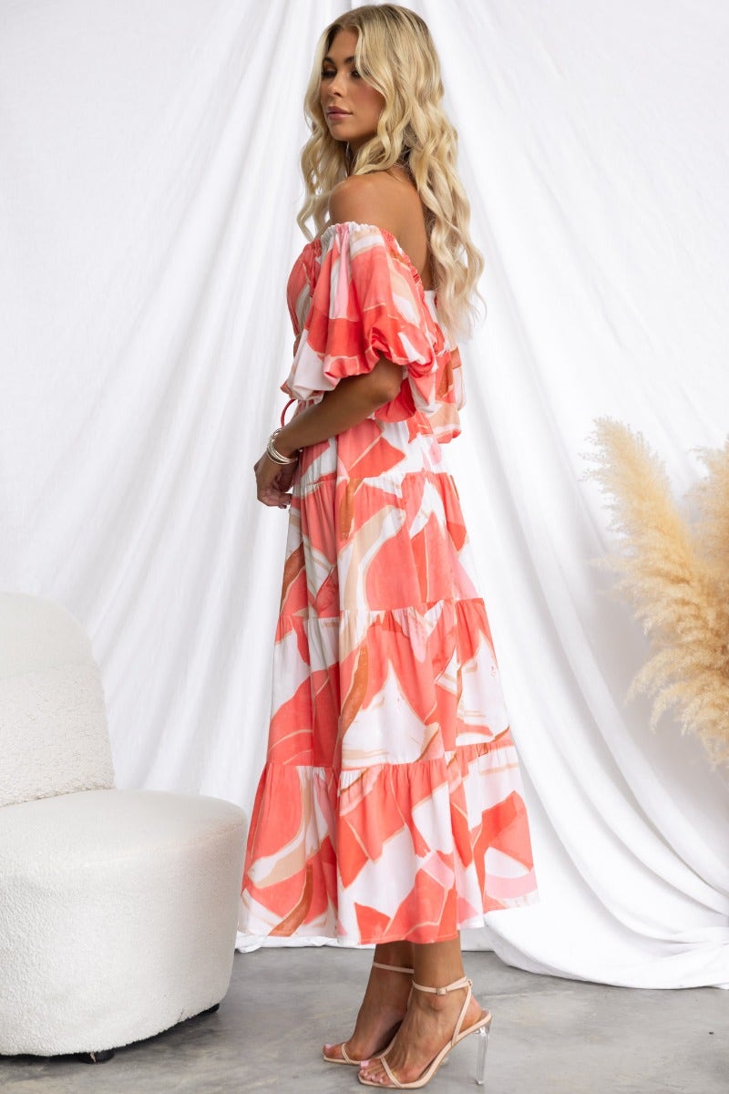 Quetta Midi Dress in multi-colour print, featuring elastic neckline and ruffled sleeves, styled with a removable tie.