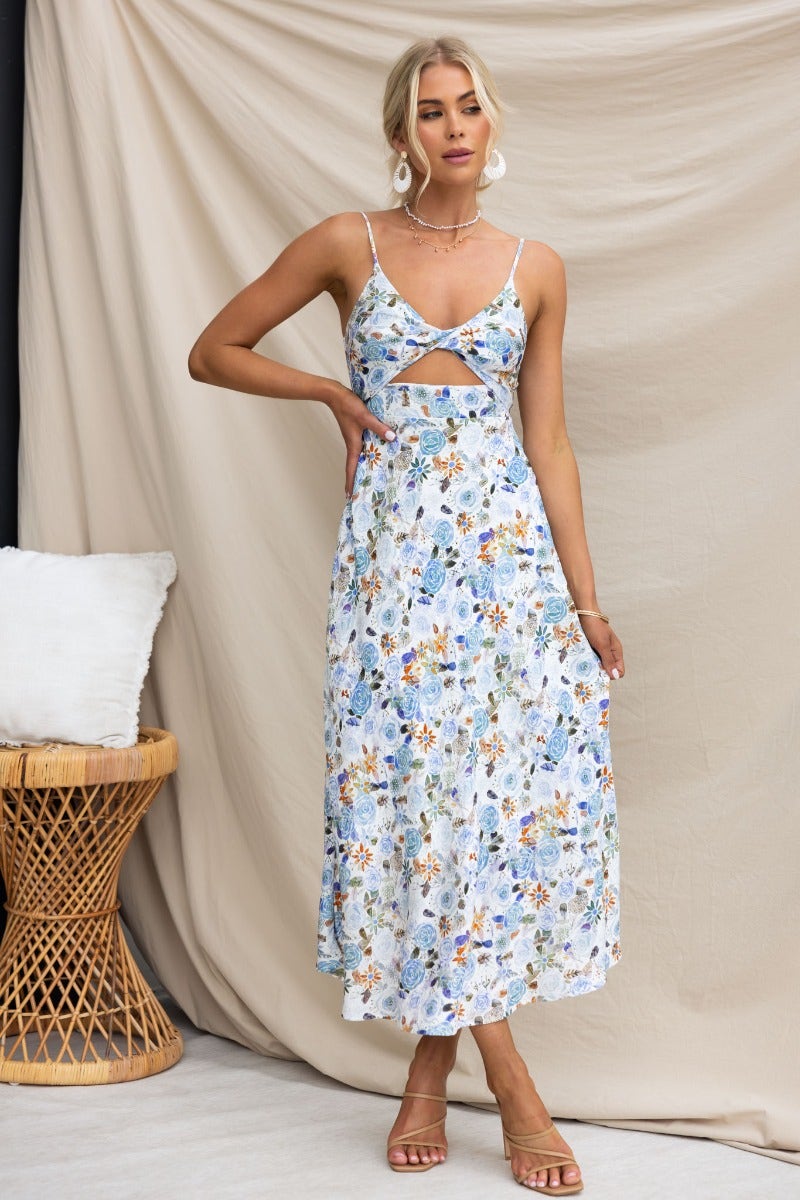 Fawn Midi Dress featuring a floral design, adjustable straps, twist detail, and cut-out under bust for a stylish look.