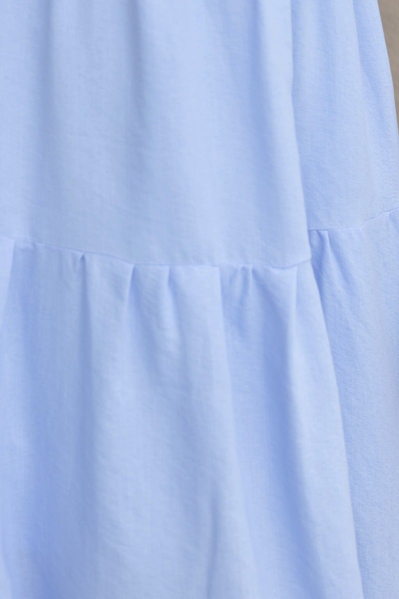 Light blue cotton blend fabric of Hanni Maxi Dress showcasing tiered design and soft texture.