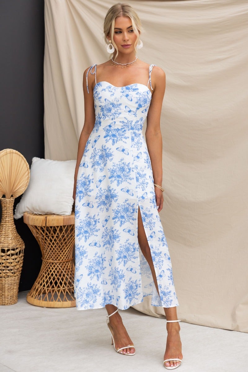 Briony Maxi Dress featuring a floral print, adjustable spaghetti straps, and a stylish front split.
