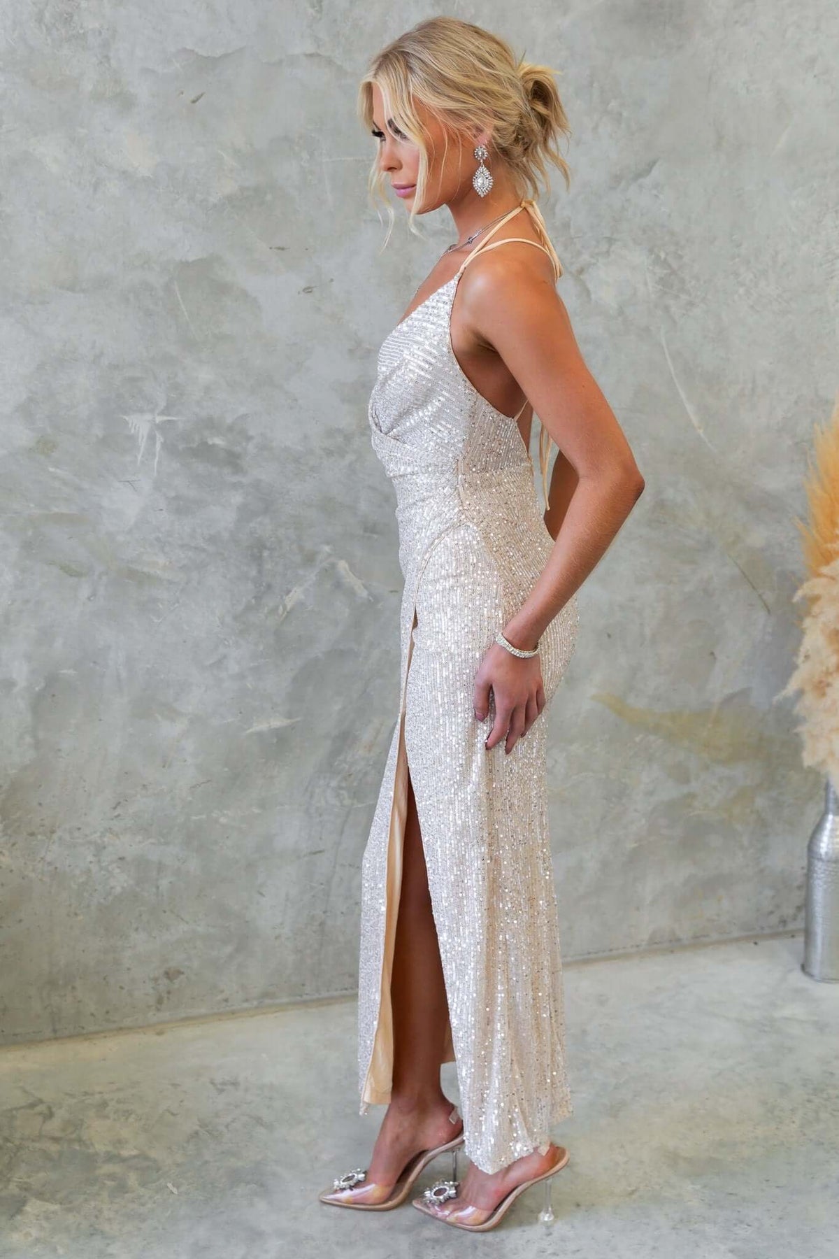 Side view of Naelle Maxi Dress featuring tie straps, sequins, and a chic asymmetric hemline.