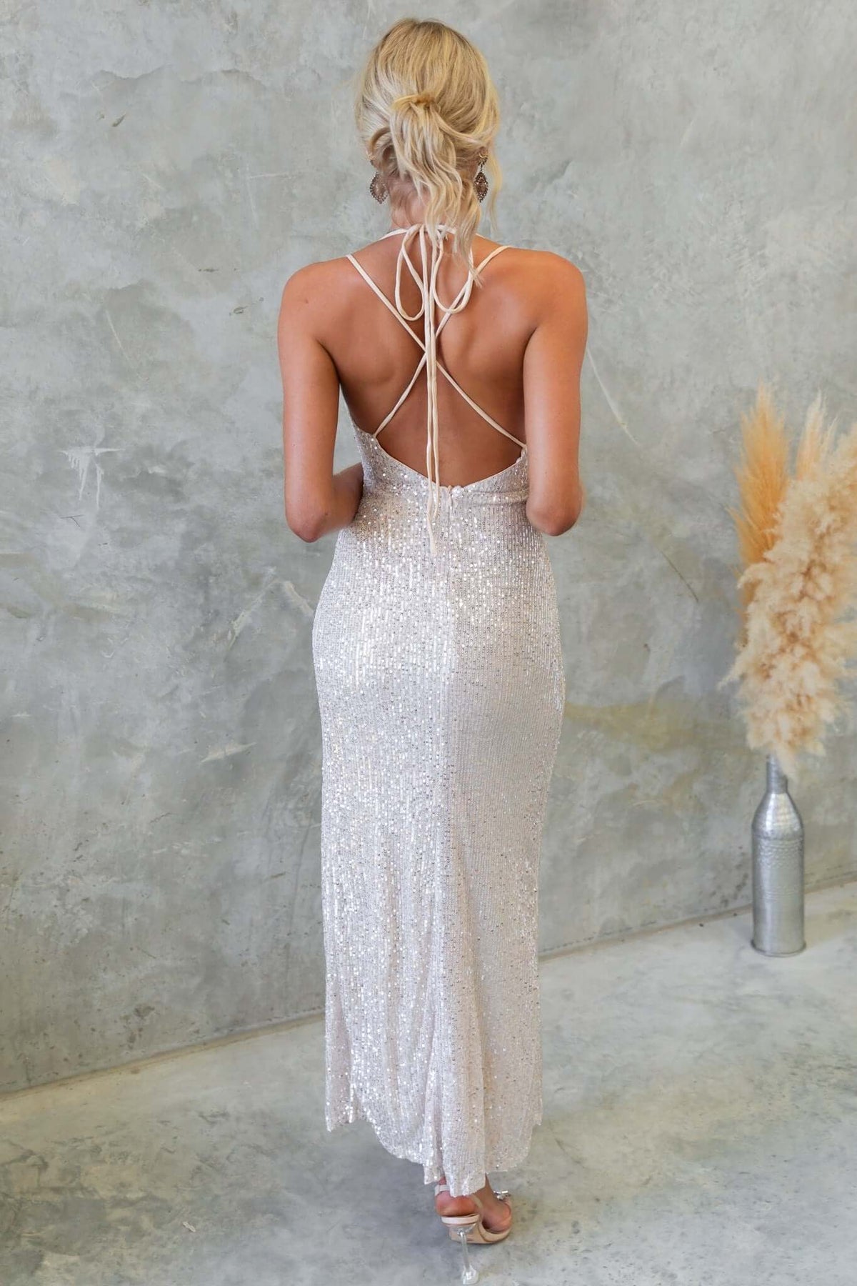 Elegant Naelle Maxi Dress featuring tie straps and a sequined design, showcasing a cowl neckline and asymmetric hemline.