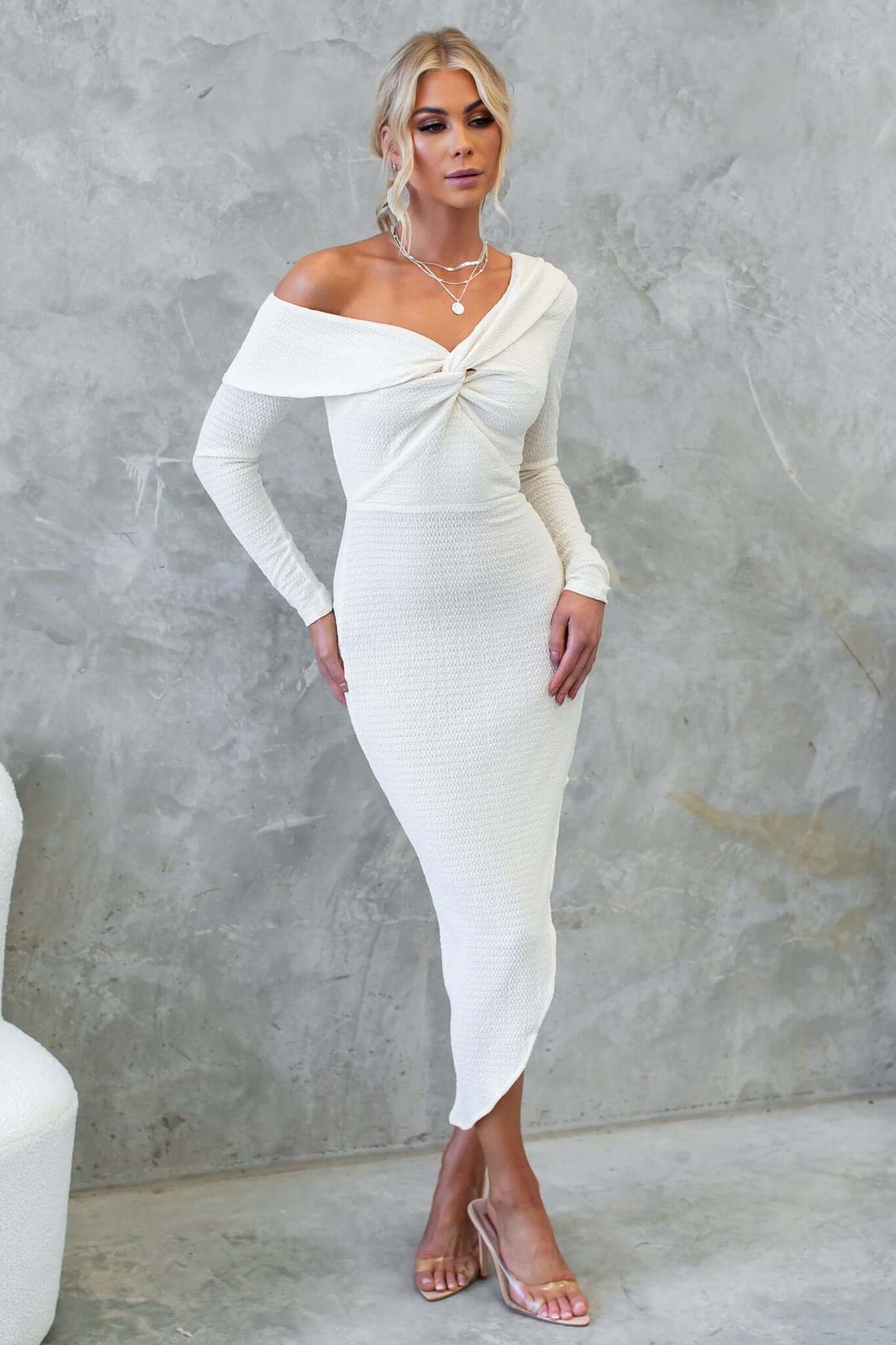 Off-shoulder Fondi Midi Dress in white, featuring an asymmetric hemline and stylish twist design.