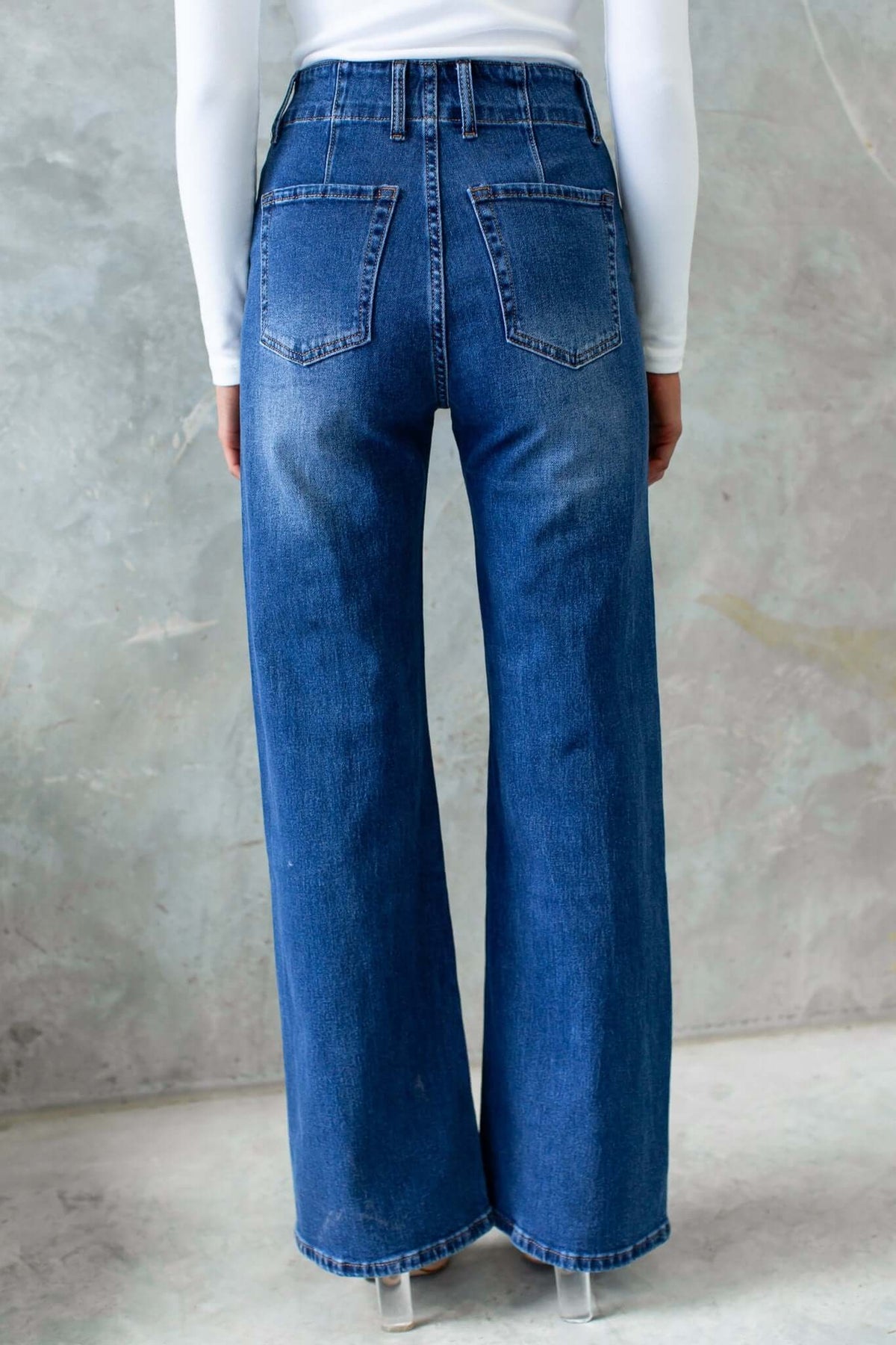 Wallen Jeans featuring mid-high waist and wide leg design, showcasing the back view and stretch denim material.