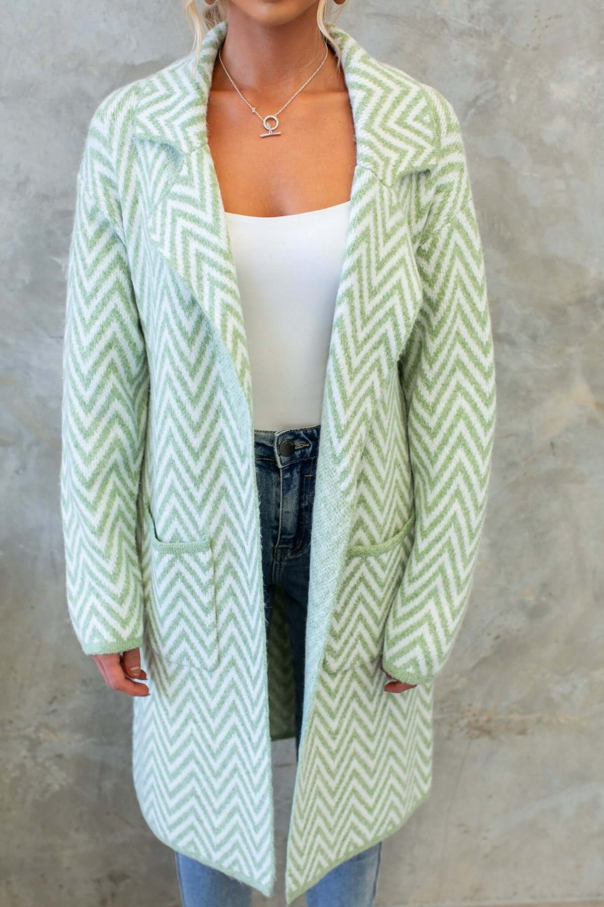 Adabella Cardigan in light green chevron pattern, featuring longline fit and pockets, crafted from knit material.