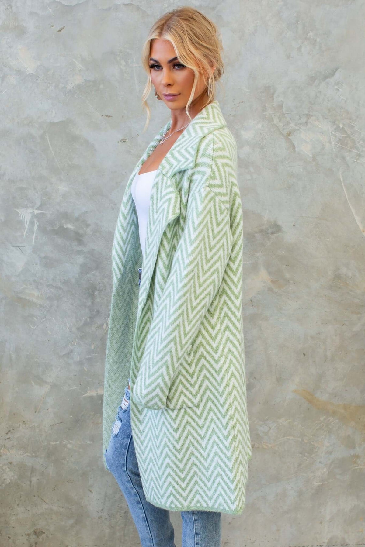 Adabella Cardigan in mint green, featuring a longline fit and chic chevron design, styled with denim and a tank top.