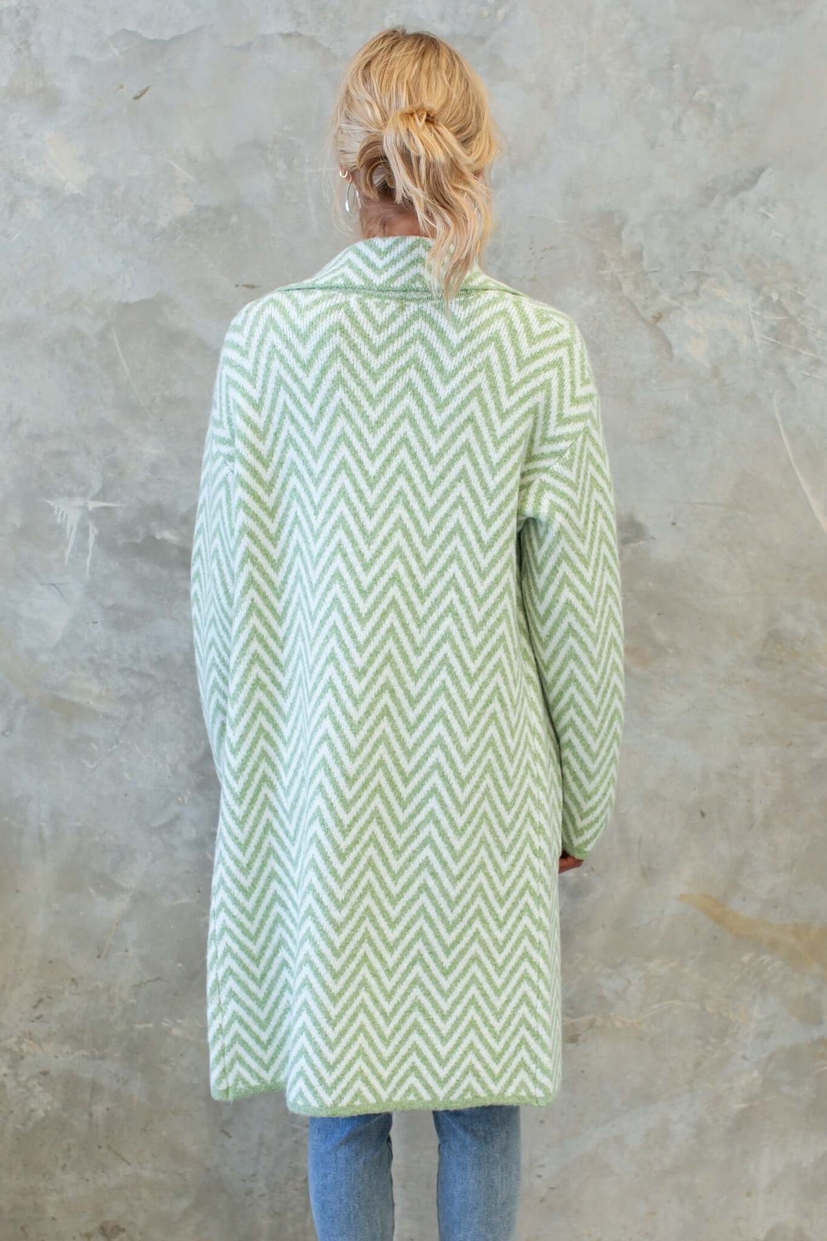 Back view of the Adabella Cardigan in mint green with a chevron pattern, featuring longline fit and pockets.