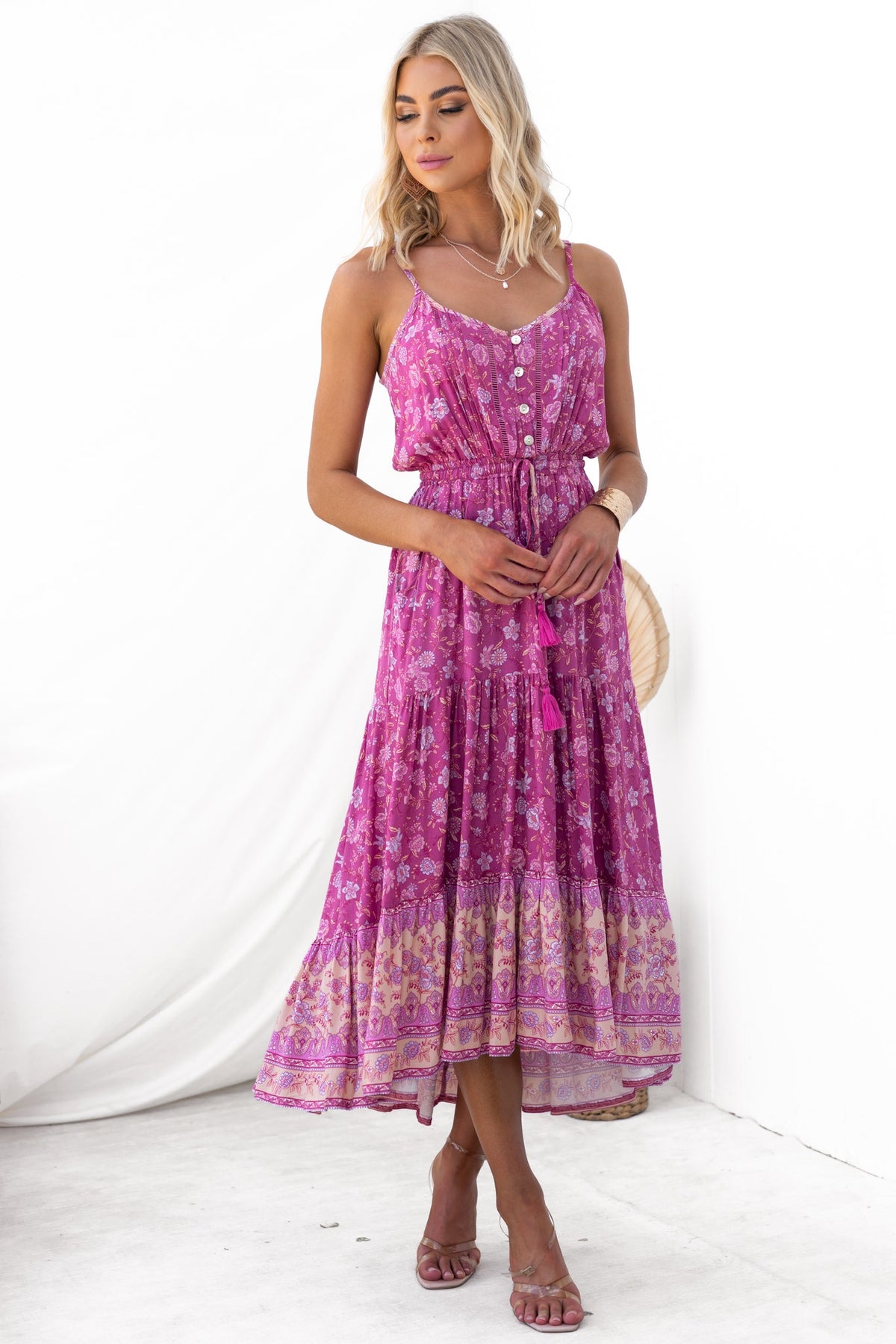 Sadelle Midi Dress in vibrant pink floral print with adjustable straps, button-up front, and elastic waistband.