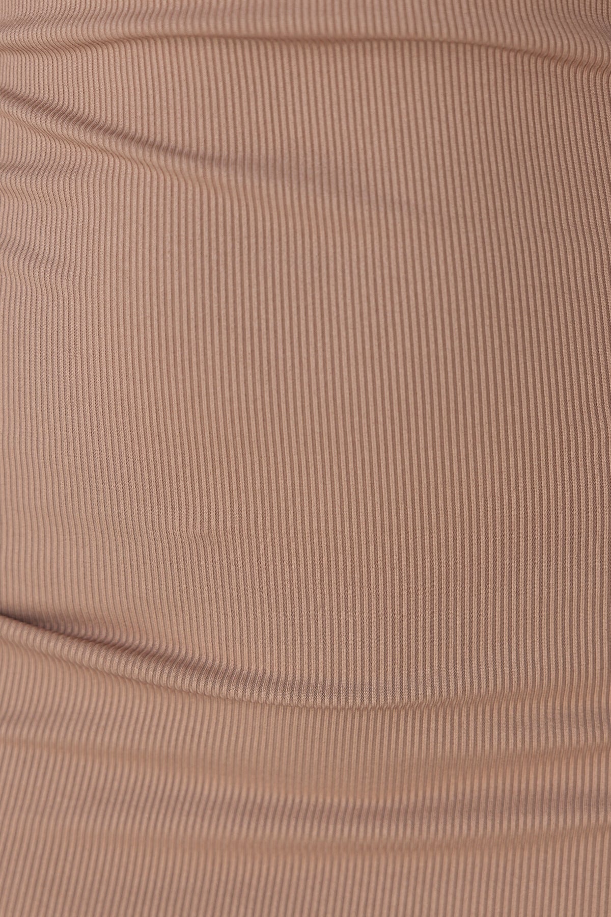 Close-up of ribbed fabric in soft brown, showcasing texture and stretch for Meena Dress.