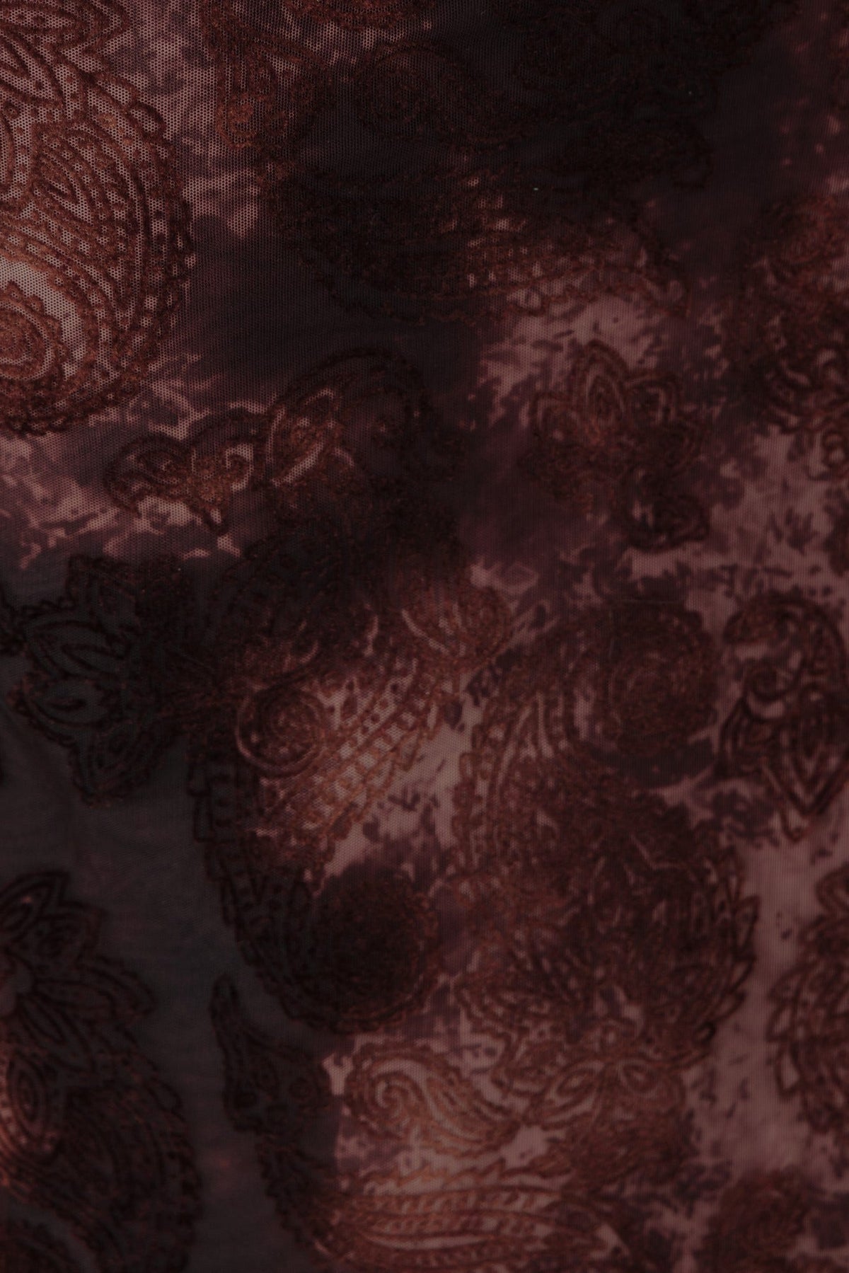 Velvet embossed print of a Karmic Midi Dress, showcasing intricate paisley patterns in rich, dark tones.
