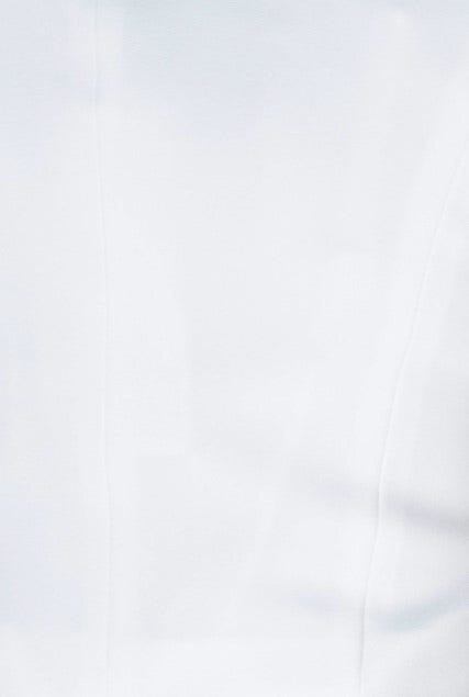 Close-up of white Oxford top featuring a smooth texture and clean lines, ideal for a stylish and modern look.