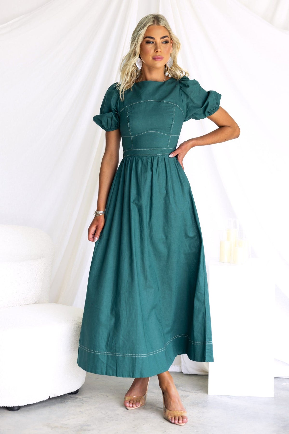 Binita Maxi Dress in teal with puff sleeves and a tie back, showcasing a stylish and elegant design.