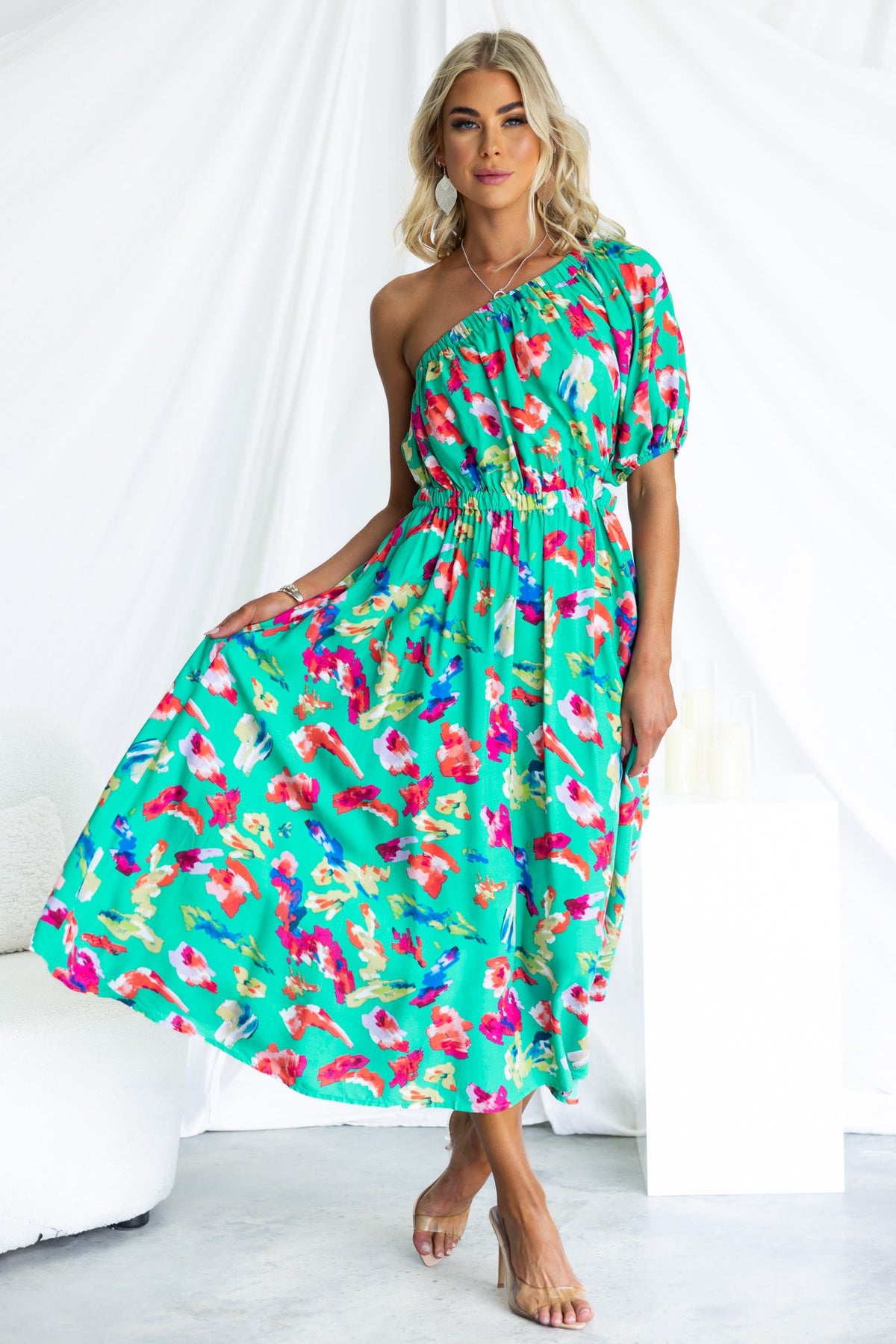 Vibrant Charmayne Midi Dress featuring one-shoulder neckline, elastic waist, cut-out detail, and floral print.