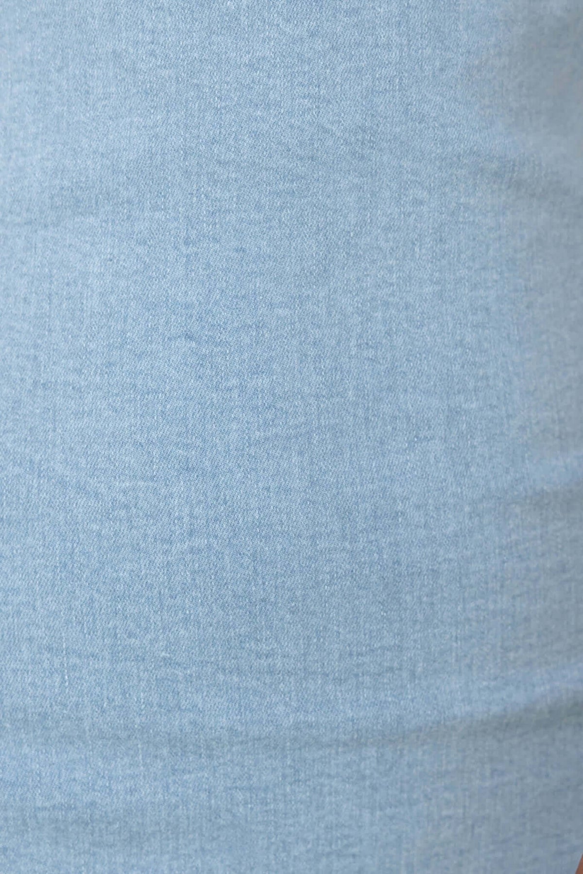 Close-up of soft light blue denim fabric texture, ideal for the Nikki Denim Maxi Dress's stylish design.