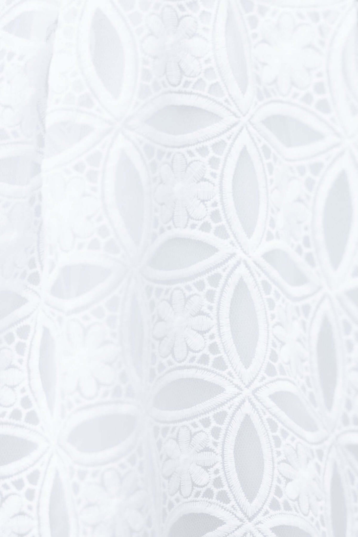 Close-up of intricate white lace fabric with floral patterns, perfect for a bridal dress like the Millicent Dress.