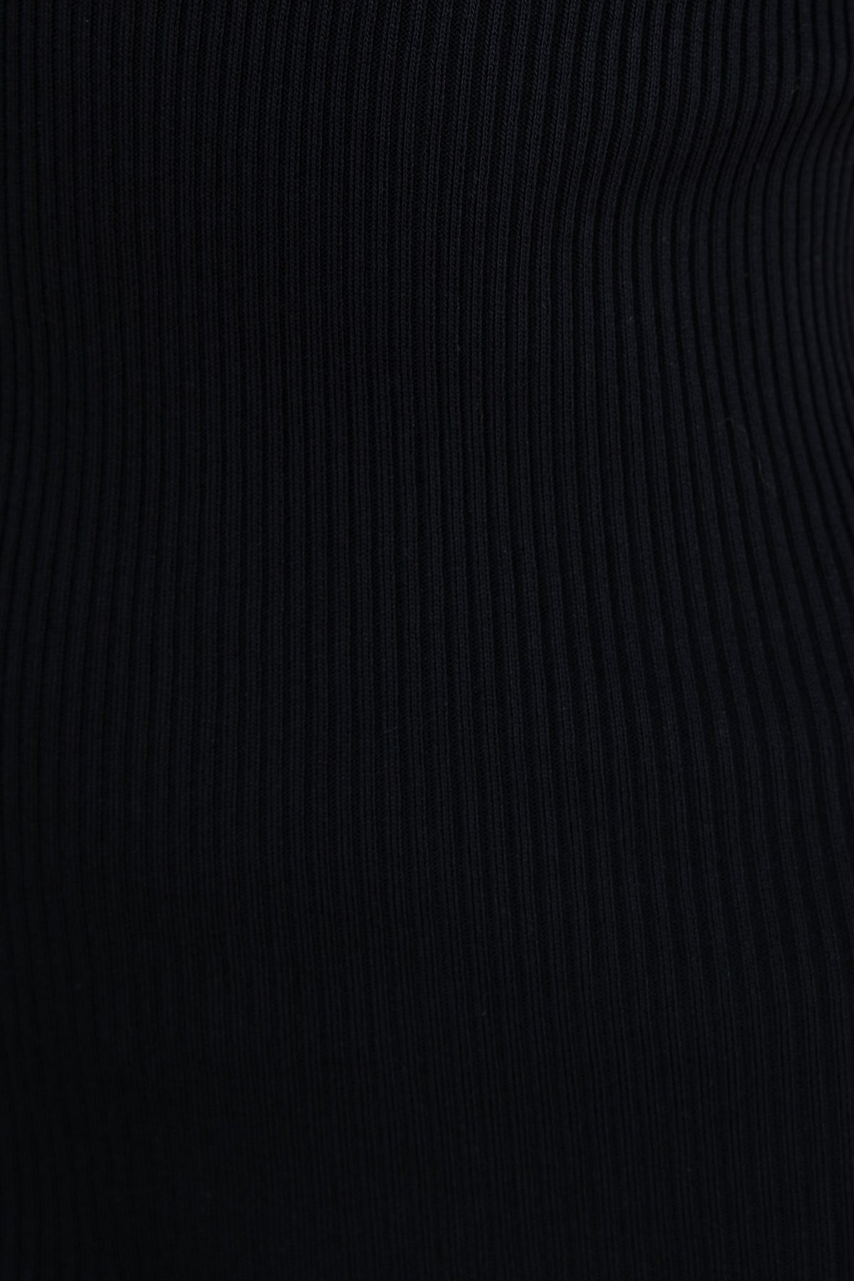 Close-up of black ribbed material showcasing texture and stretch, ideal for a stylish midi dress.