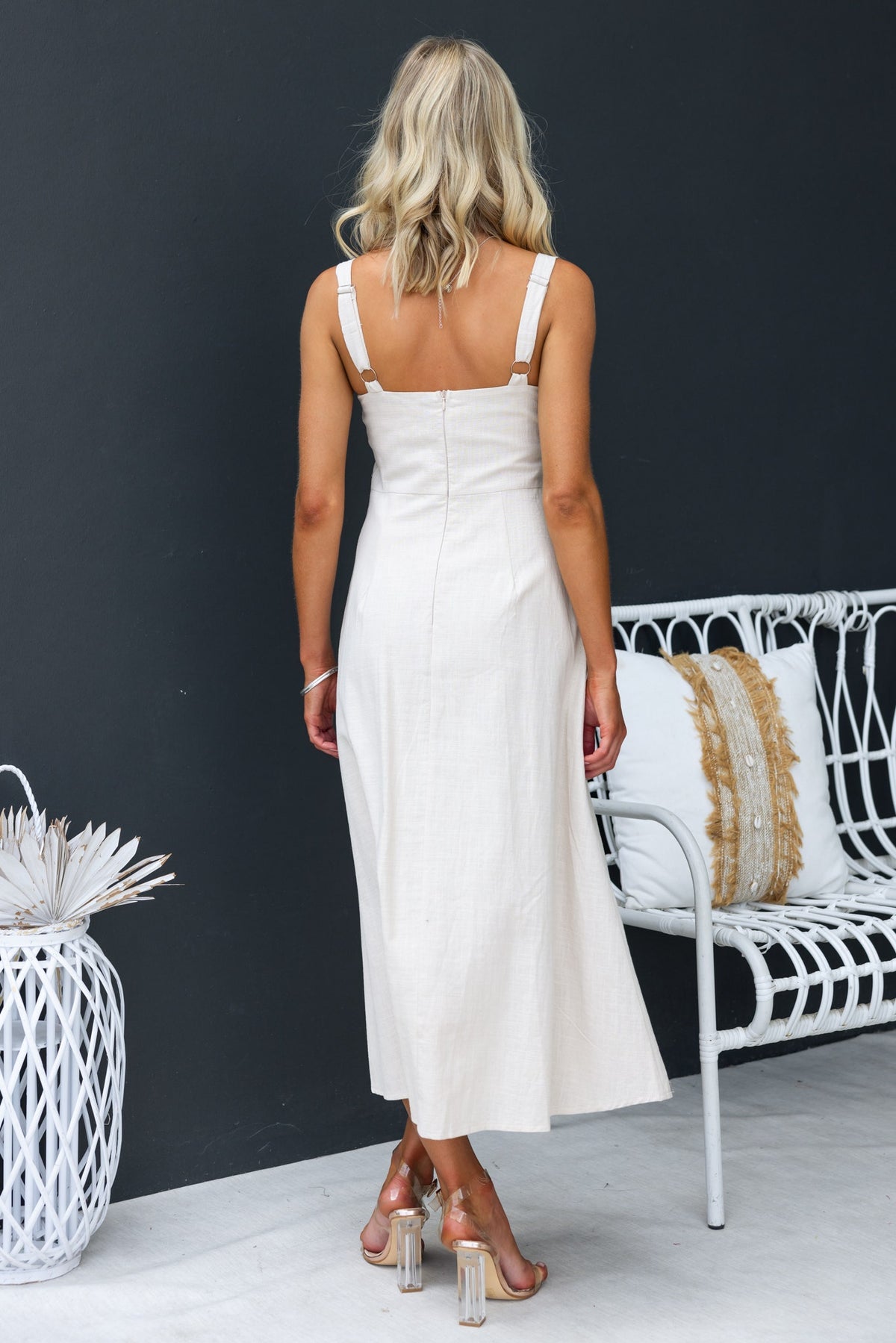 Back view of the Temila Midi Dress featuring adjustable straps and a sleek, linen look design.