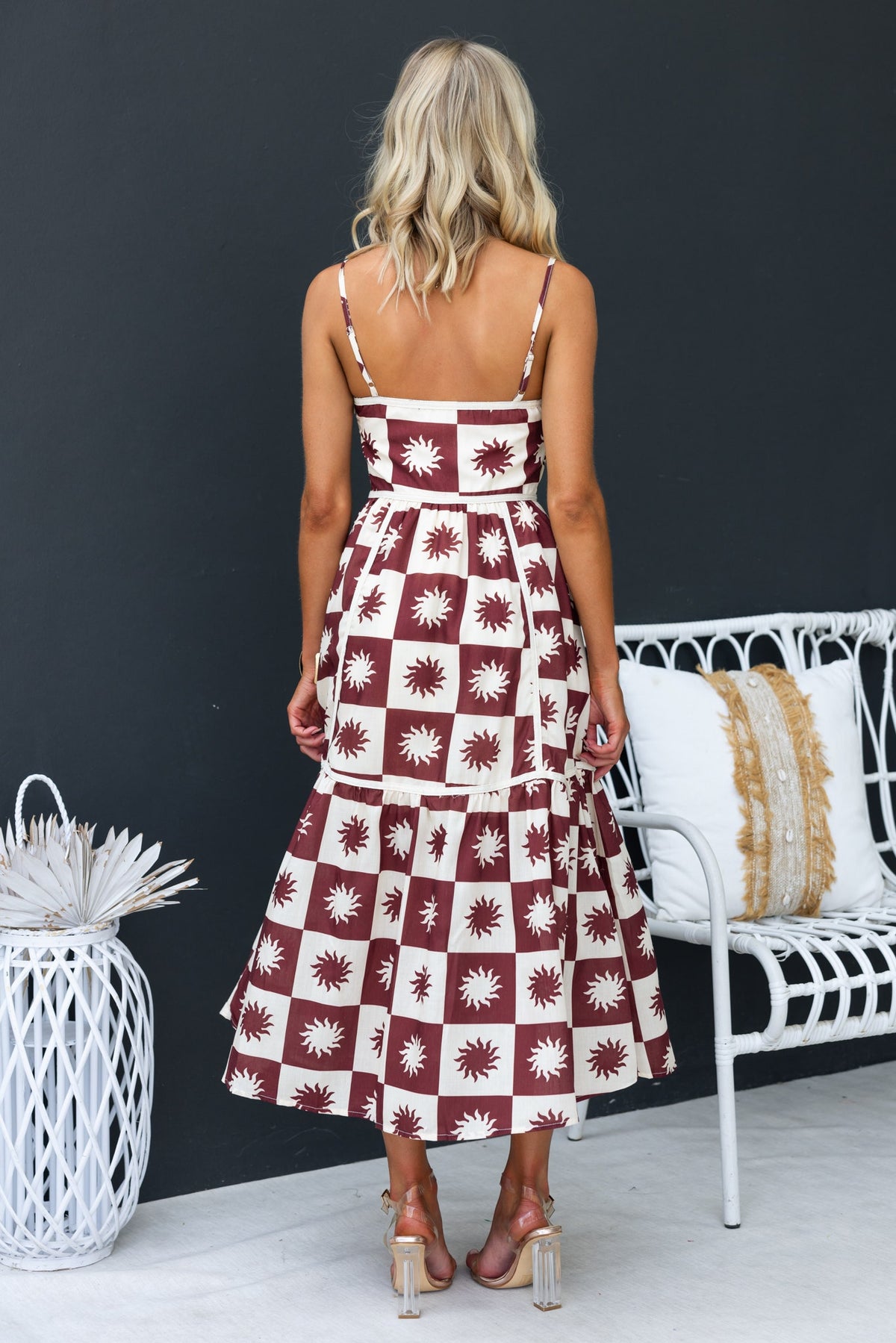 Back view of Cianna Midi Dress featuring adjustable straps and a floral pattern, perfect for summer outings.