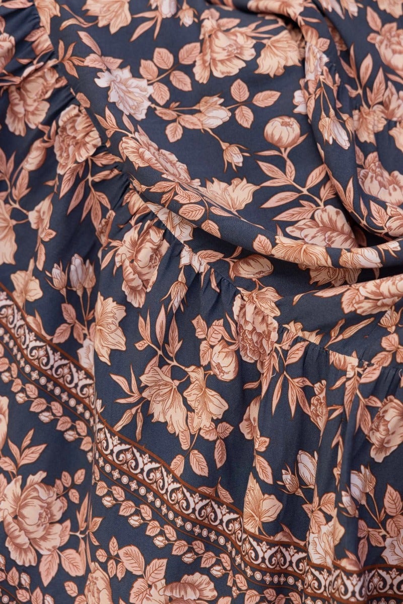 Navy floral print fabric detail of Etsie Maxi Dress featuring soft roses and elegant design.
