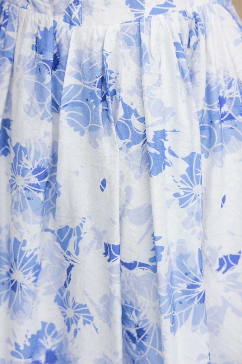 Floral print fabric close-up of the Already Gone Dress featuring blue and white hues.