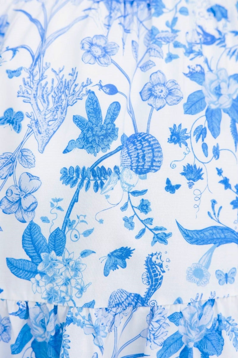 Blue floral print fabric featuring intricate designs of flowers and plants, perfect for a stylish Sariah Skirt.