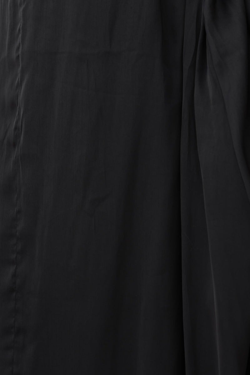 Close-up of the Kariah Maxi Dress, featuring luxurious black fabric with a sleek, smooth texture.