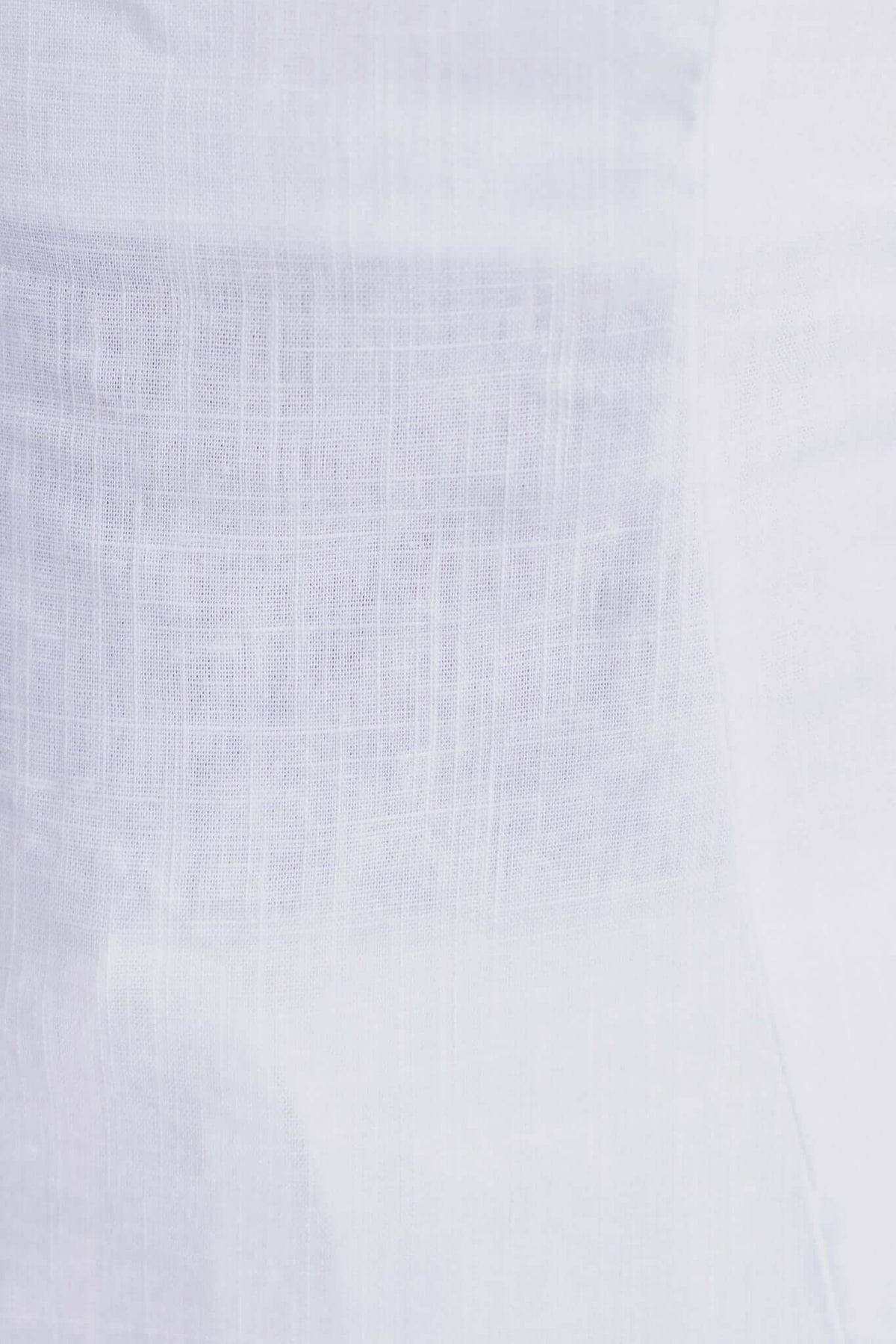 Close-up of lightweight fabric texture used in Irina Pants, highlighting the soft white linen and rayon blend.