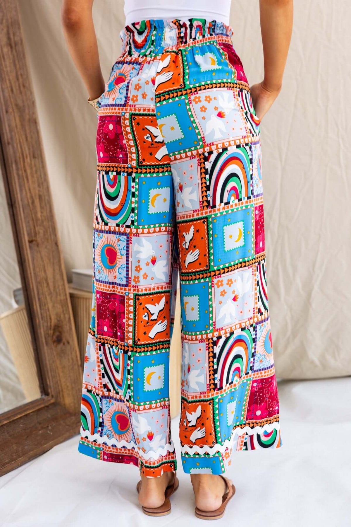 Maito Pants featuring colorful patchwork design, mid-high waist, elastic waistband, and pockets, perfect for summer outfits.