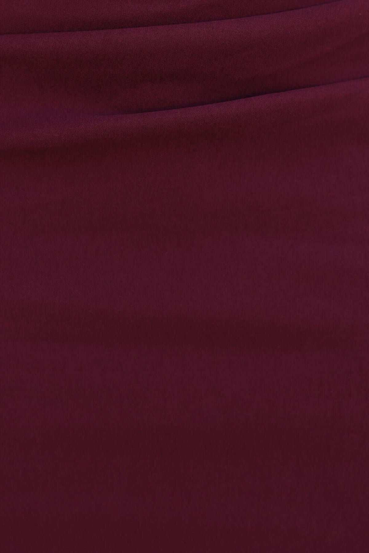 Burgundy fabric texture highlighting the smooth stretch material of the Maris Maxi Dress.