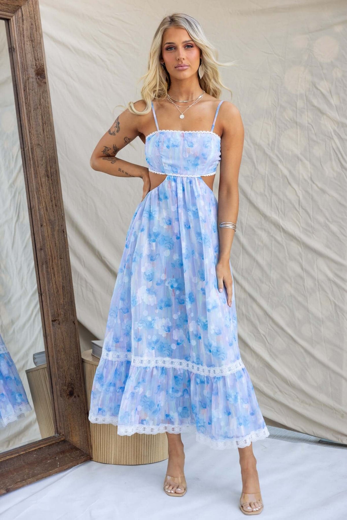 Light blue Klair Maxi Dress featuring adjustable straps, cut-out back, and elastic detail, styled for a summer look.