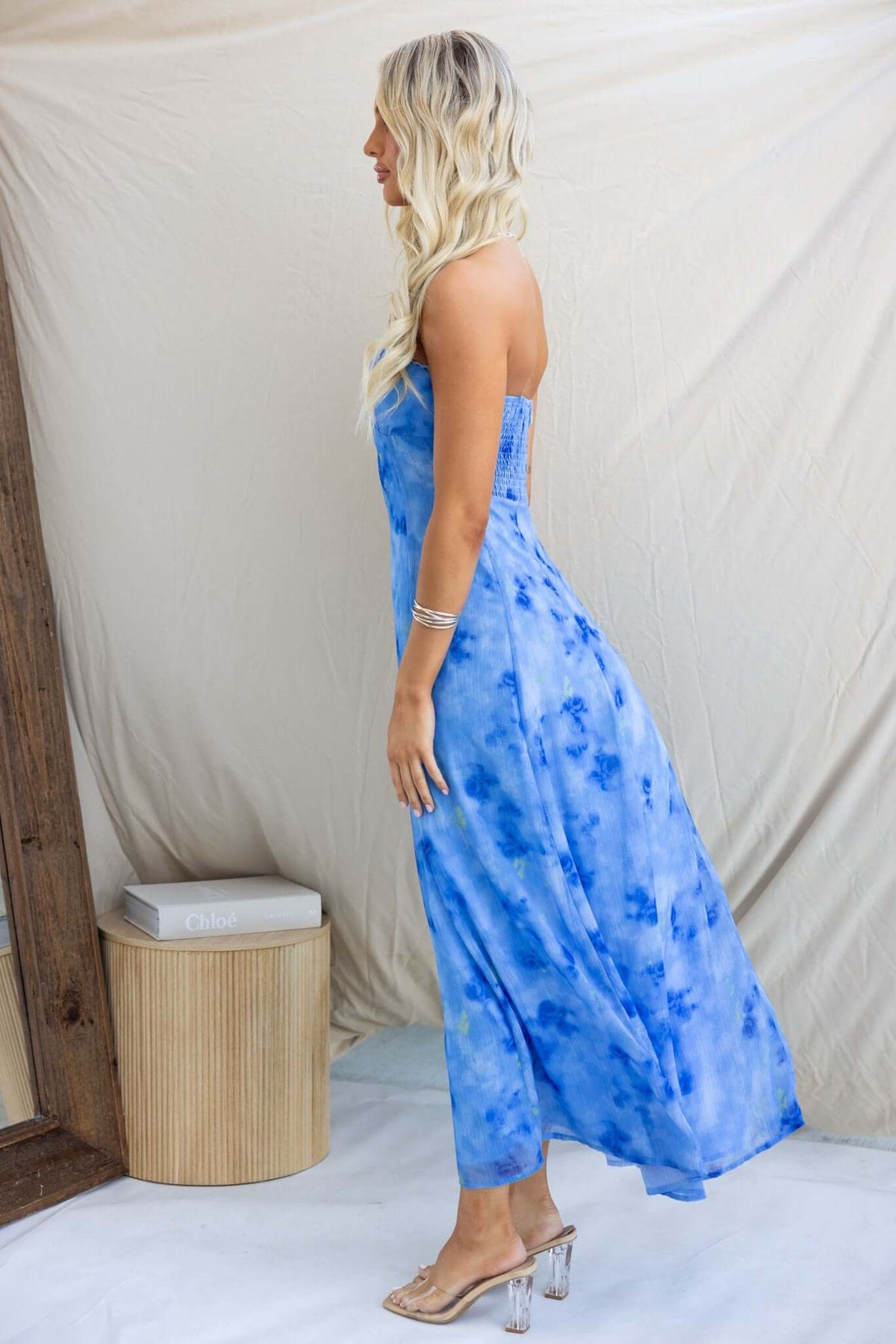Daeja Midi Dress in blue tie-dye, strapless design with elastic back and invisible zip, showcased by a model from the side.