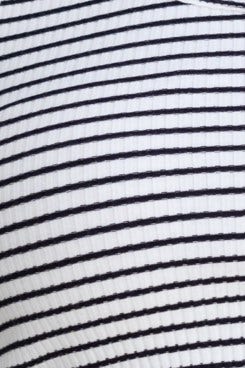 Close-up of white and black striped ribbed fabric, featuring stretch material, ideal for a stylish crop top.