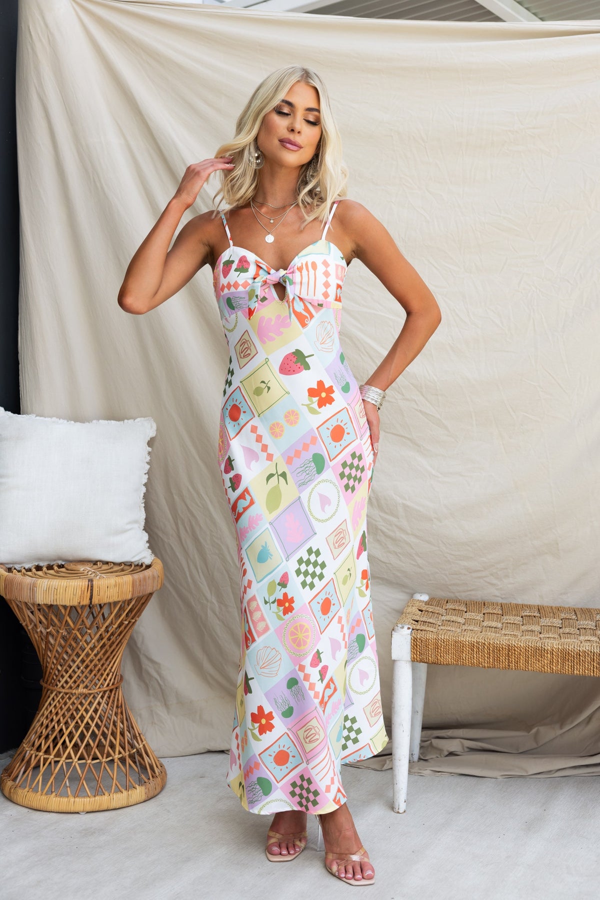 Noire Maxi Dress featuring adjustable straps and floral print, perfect for summer style.