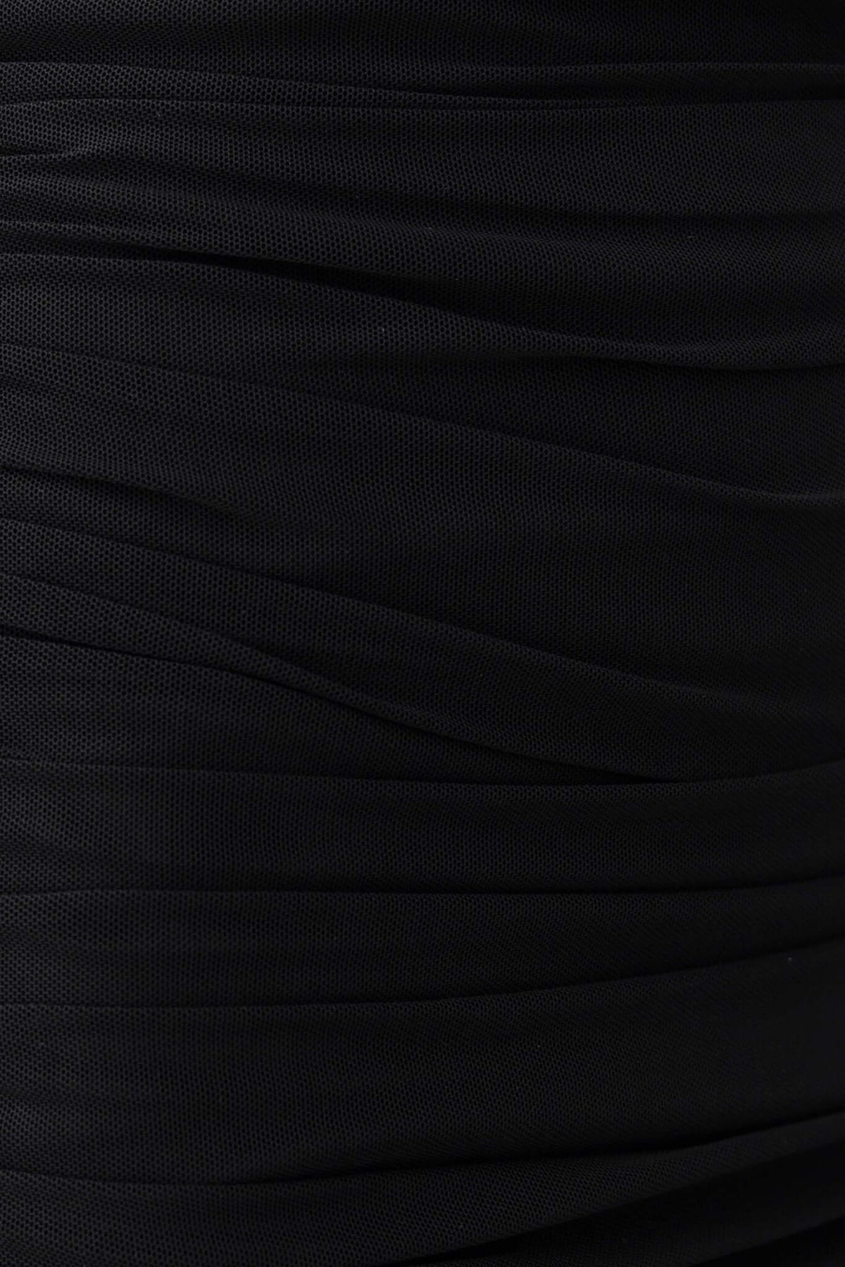 Close-up of ruching detail in black mesh material for the Scarlet Midi Dress, showcasing texture and style.