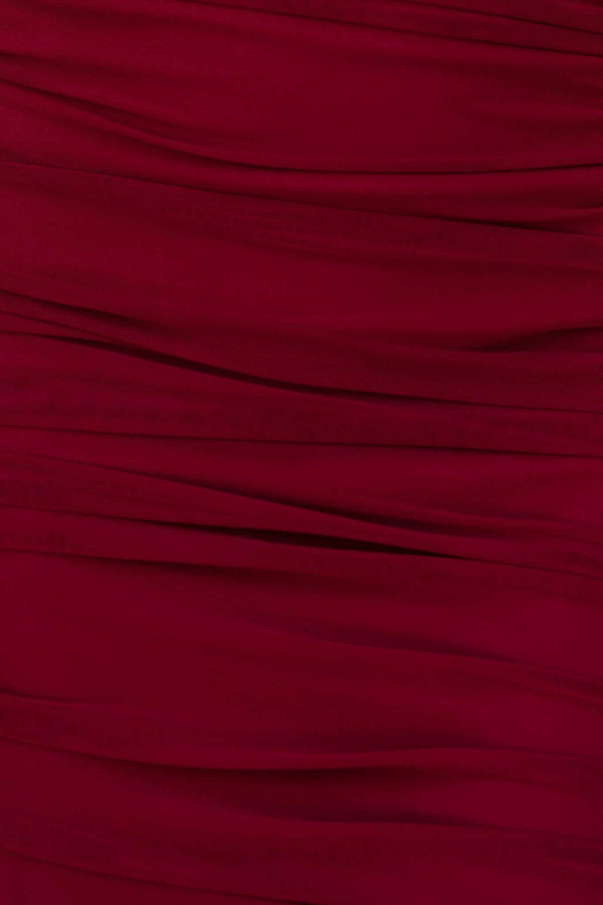 Close-up of the ruching detail on a scarlet midi dress, showcasing the soft mesh texture and vibrant color.