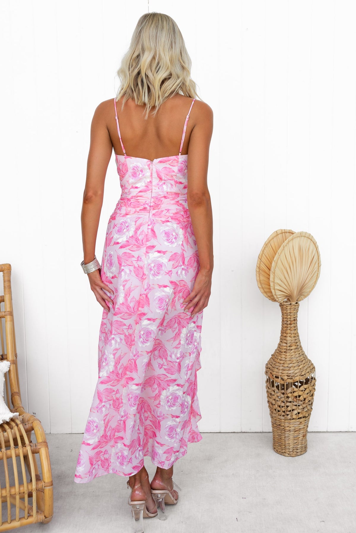 Back view of a pink floral Maxi Dress with adjustable straps and a side split, perfect for casual summer outings.
